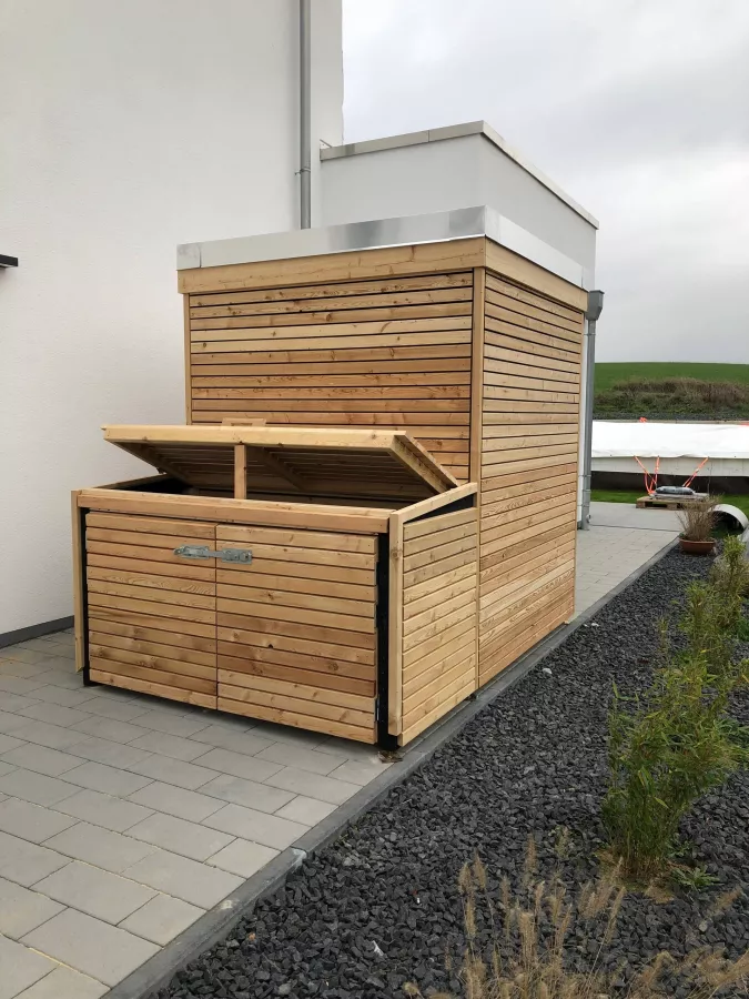 Natürliche Harmonie Gartenhütte mit stilvoller Mülllösung